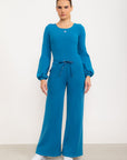 Calça flare Entusiasmo de cintura alta com bolsos laterais e tecido tecnológico - Azul Cobalto ROWA DROP2