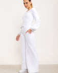 Calça flare Entusiasmo de cintura alta com bolsos laterais e tecido tecnológico - Branco ROWA DROP2