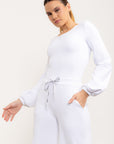 Calça flare Entusiasmo de cintura alta com bolsos laterais e tecido tecnológico - Branco ROWA DROP2