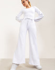 Calça flare Entusiasmo de cintura alta com bolsos laterais e tecido tecnológico - Branco ROWA DROP2